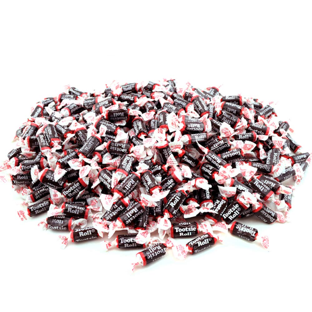 Tootsie Roll Midgees candies in hand, perfect treat for classrooms and parties.