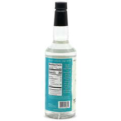 Classic tonic syrup being added to sparkling seltzer for G&amp;T base