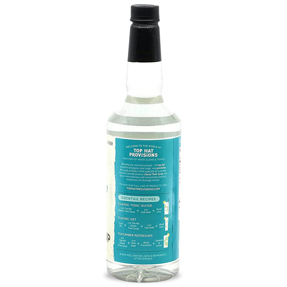 Top Hat Provisions 32oz bottle on kitchen counter with botanicals