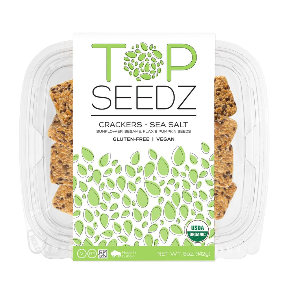 Top Seedz seed crackers on a picnic board with cheese and fruit