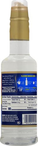 Torani Almond Syrup bottle near soda and ice for Italian sodas