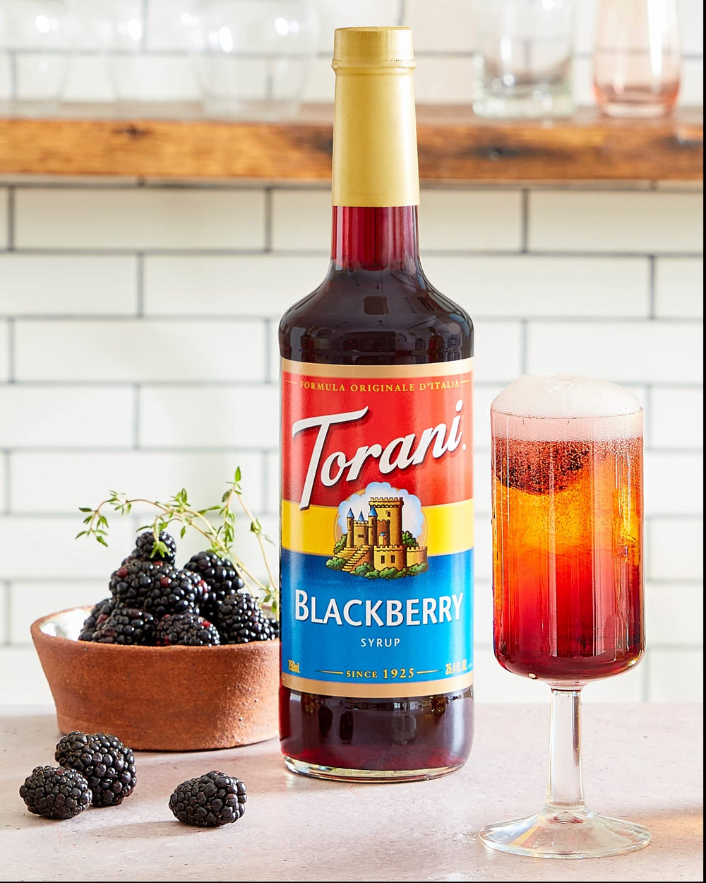 Torani Blackberry Syrup poured into a cocktail glass with garnish