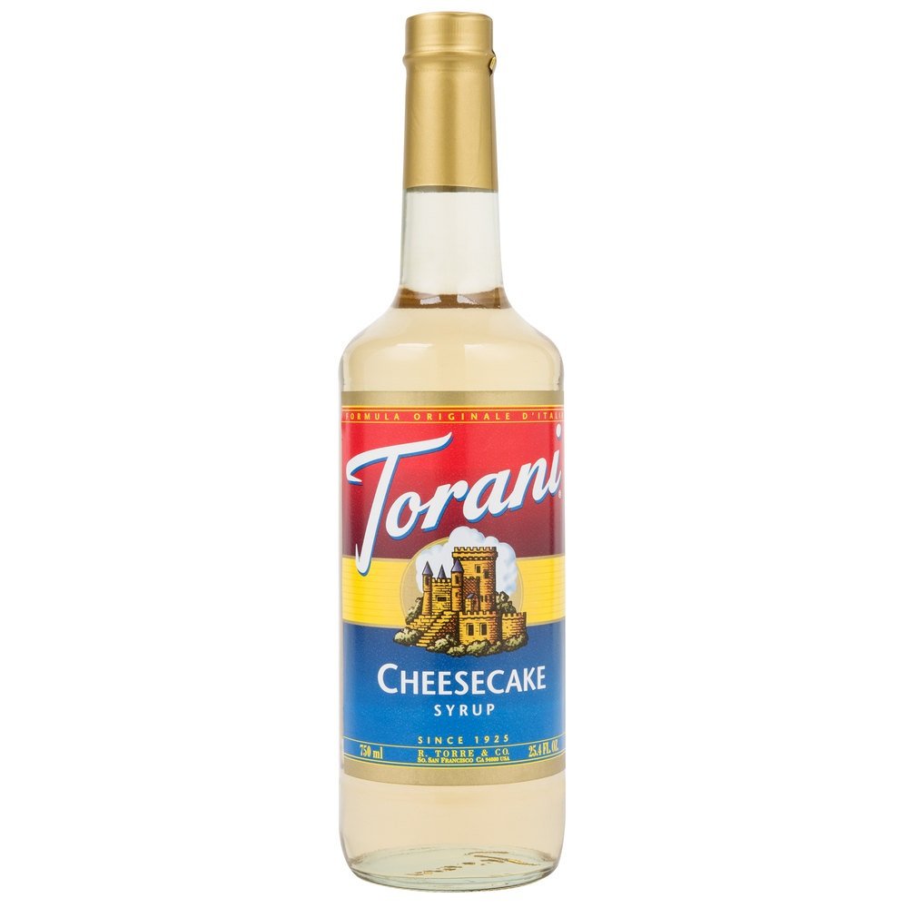 Torani Cheesecake Syrup bottle closeup highlighting creamy flavor for coffee and desserts.