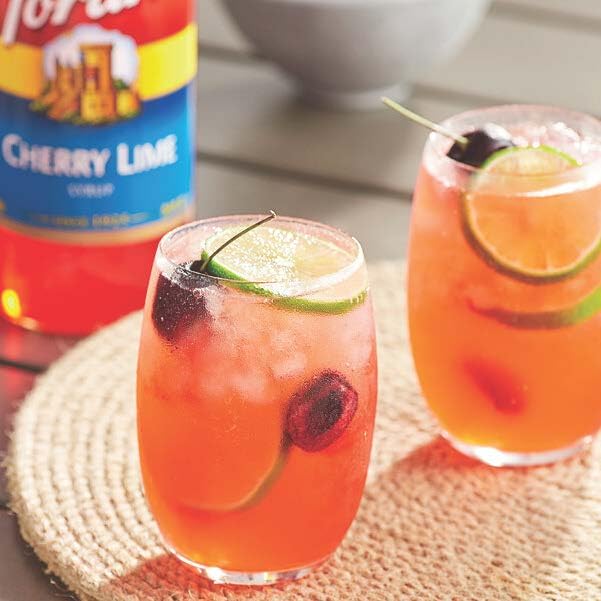 Close pour of Torani Cherry Lime ready to flavor drinks