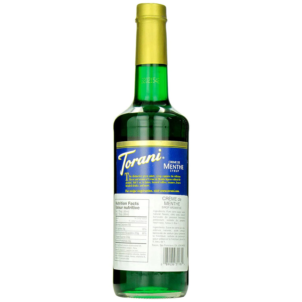 Torani Creme De Menthe syrup in a cocktail glass for minty finish.