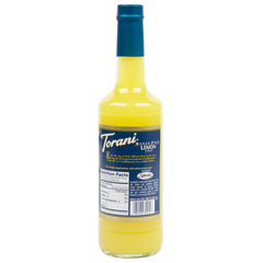 Torani Lemon Syrup Sugar Free being poured into coffee for bright, sugar-free lemon taste.