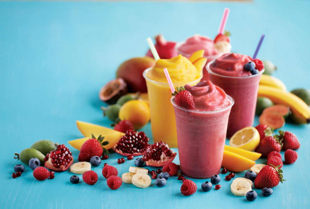 Torani Peach Real Fruit Smoothie Mix blended smoothie in a tall glass