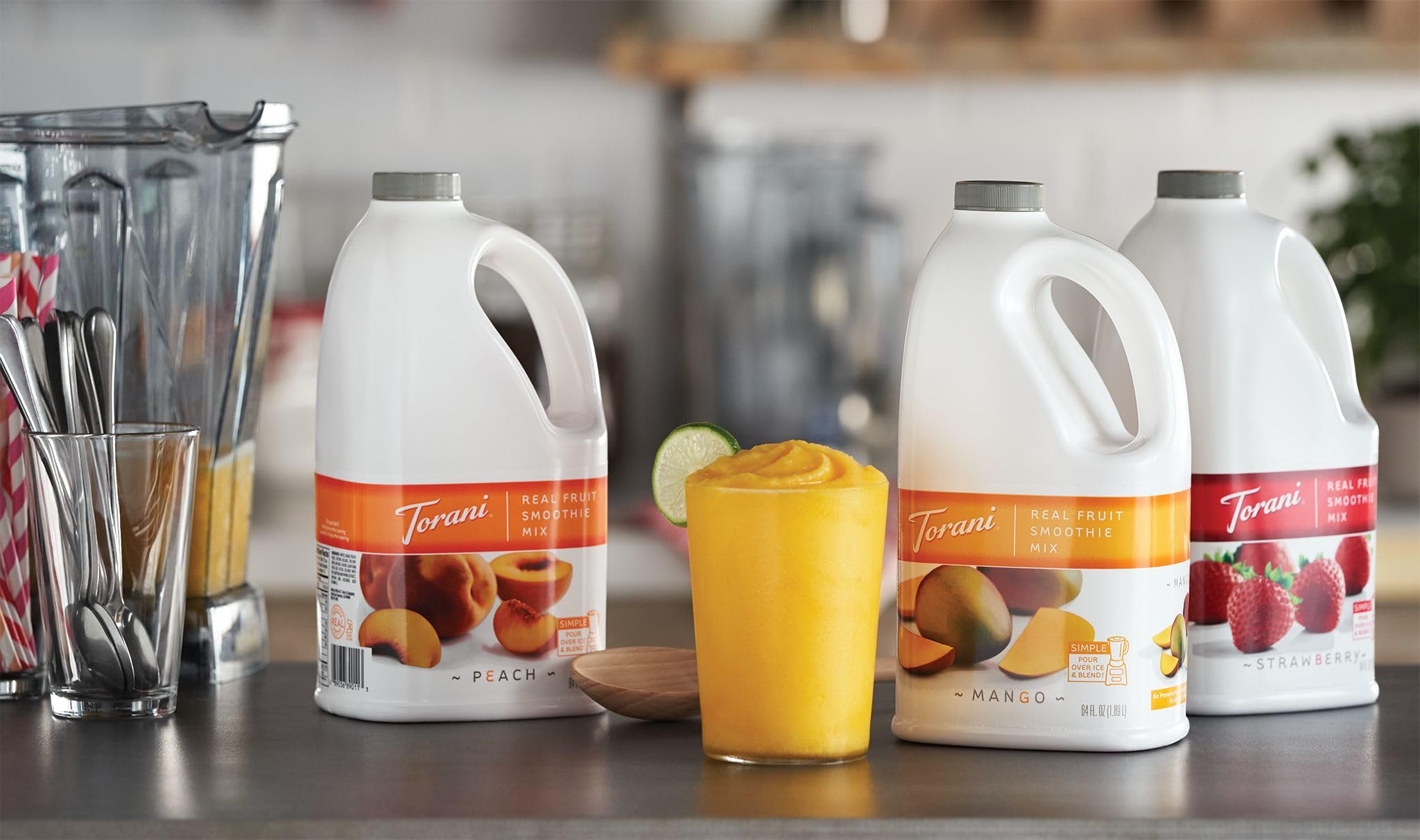 Torani Peach Smoothie Mix glass with pour prepared for blending
