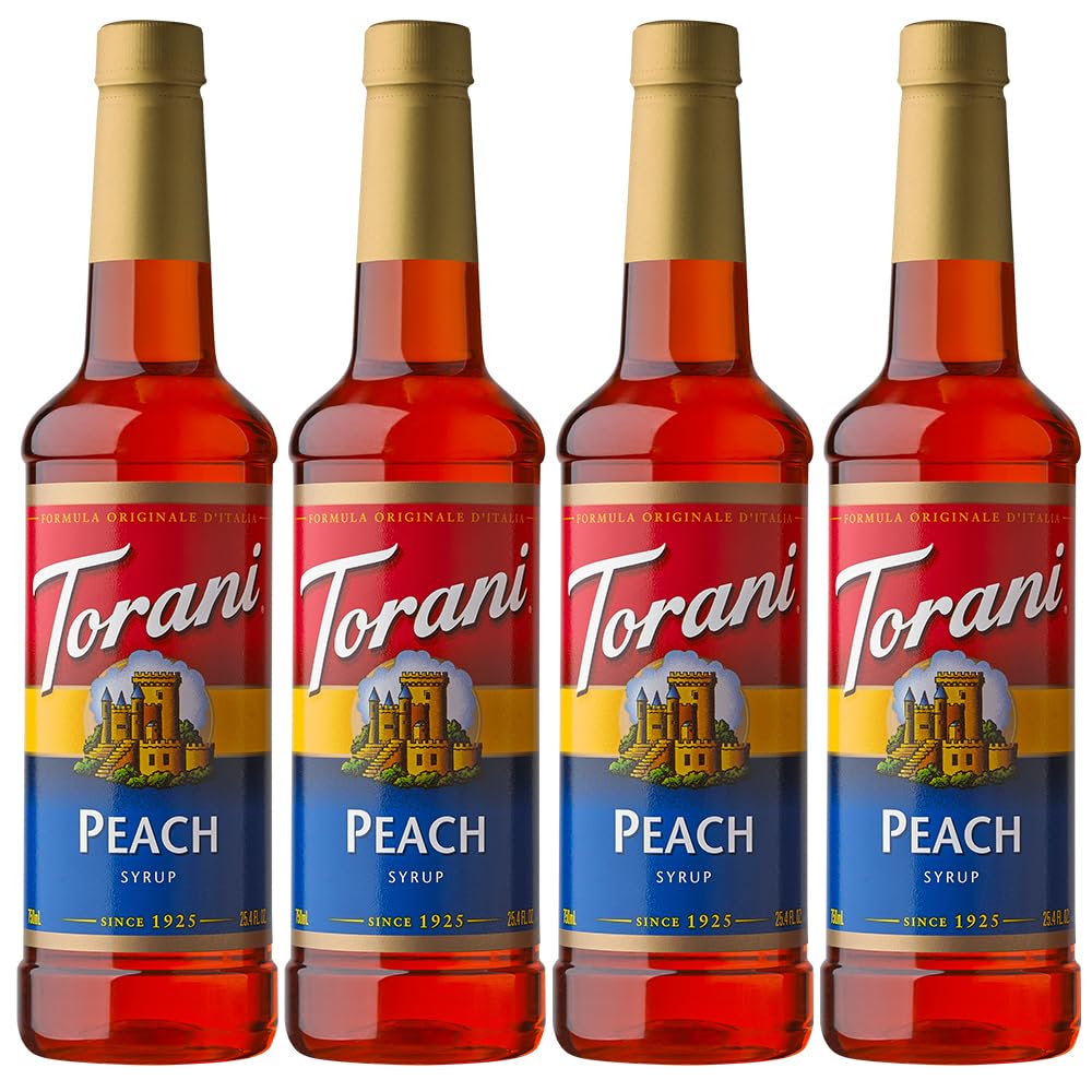 Torani Peach Syrup bottle with peaches for peach-flavored drinks.