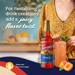 Torani Peach Syrup poured over iced tea for brightness