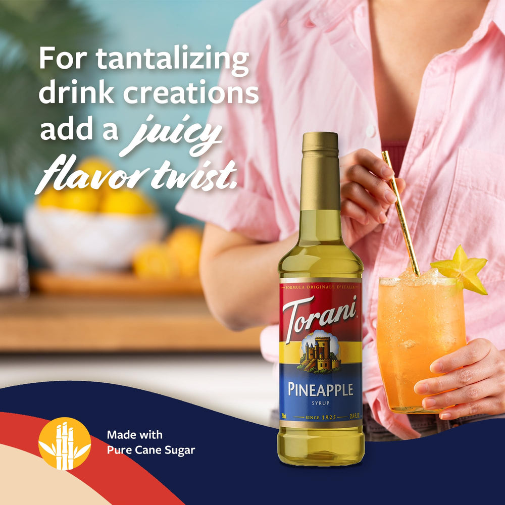 Glass with tropical drink made with Torani Pineapple Syrup.