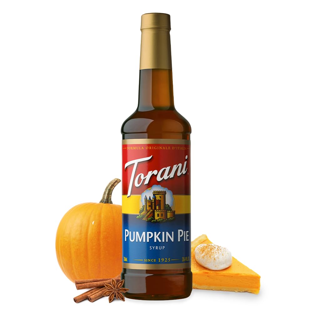 Cozy kitchen scene with Torani Pumpkin Pie Syrup and whipped cream.