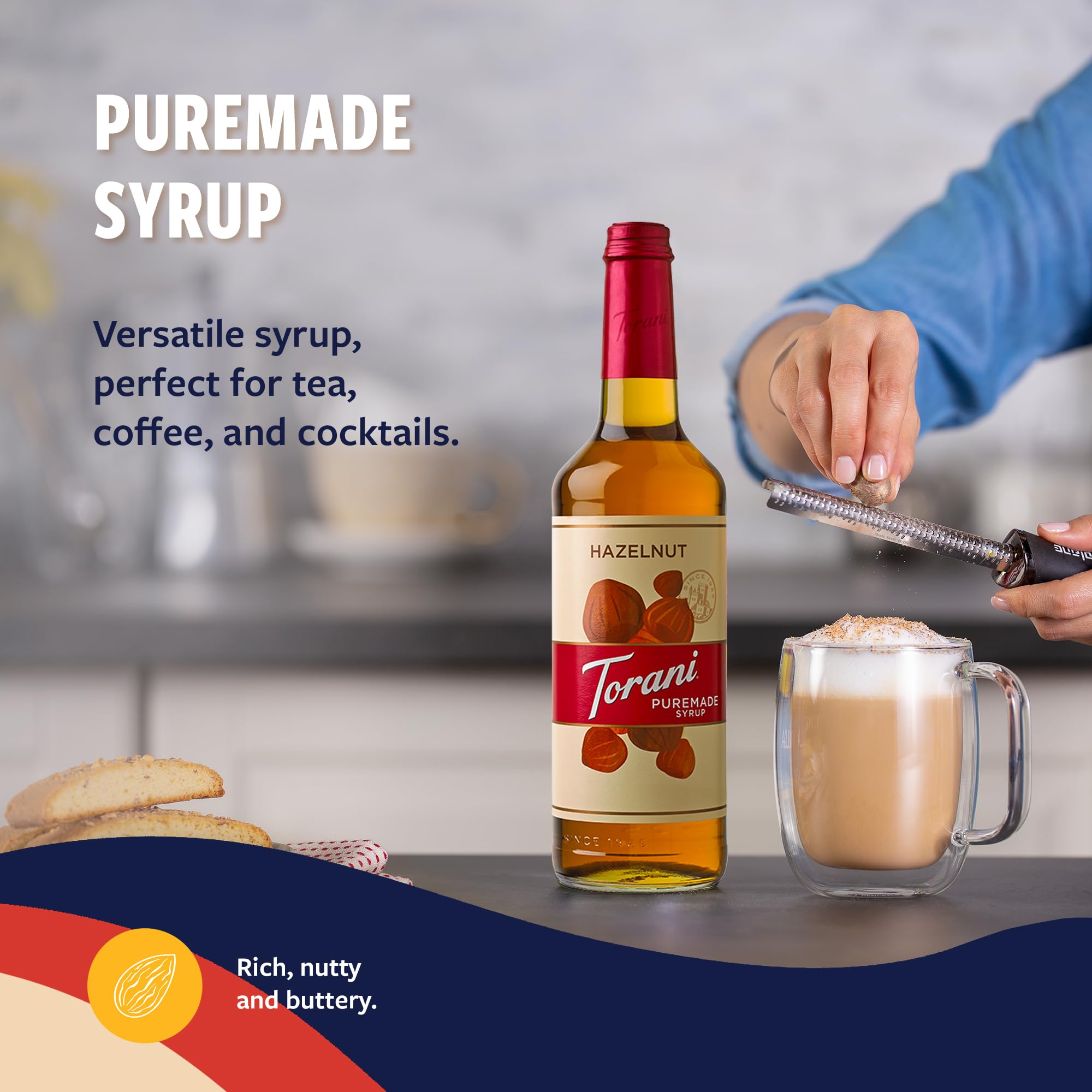 Torani Puremade Hazelnut Syrup being poured over a drink.