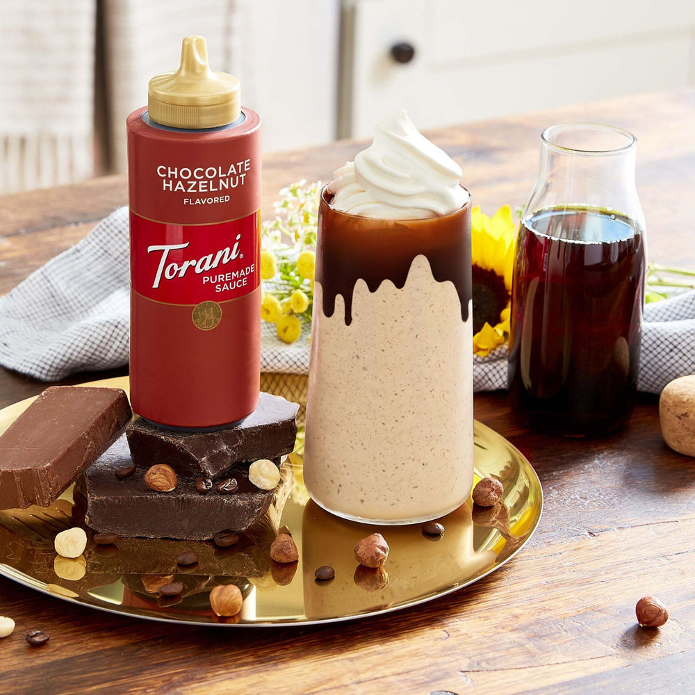 Torani Puremade Pumpkin Pie sauce with coffee for flavorful lattes.