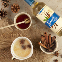 Torani Puremade Zero Sugar Caramel Syrup drizzled into iced tea for caramel finish