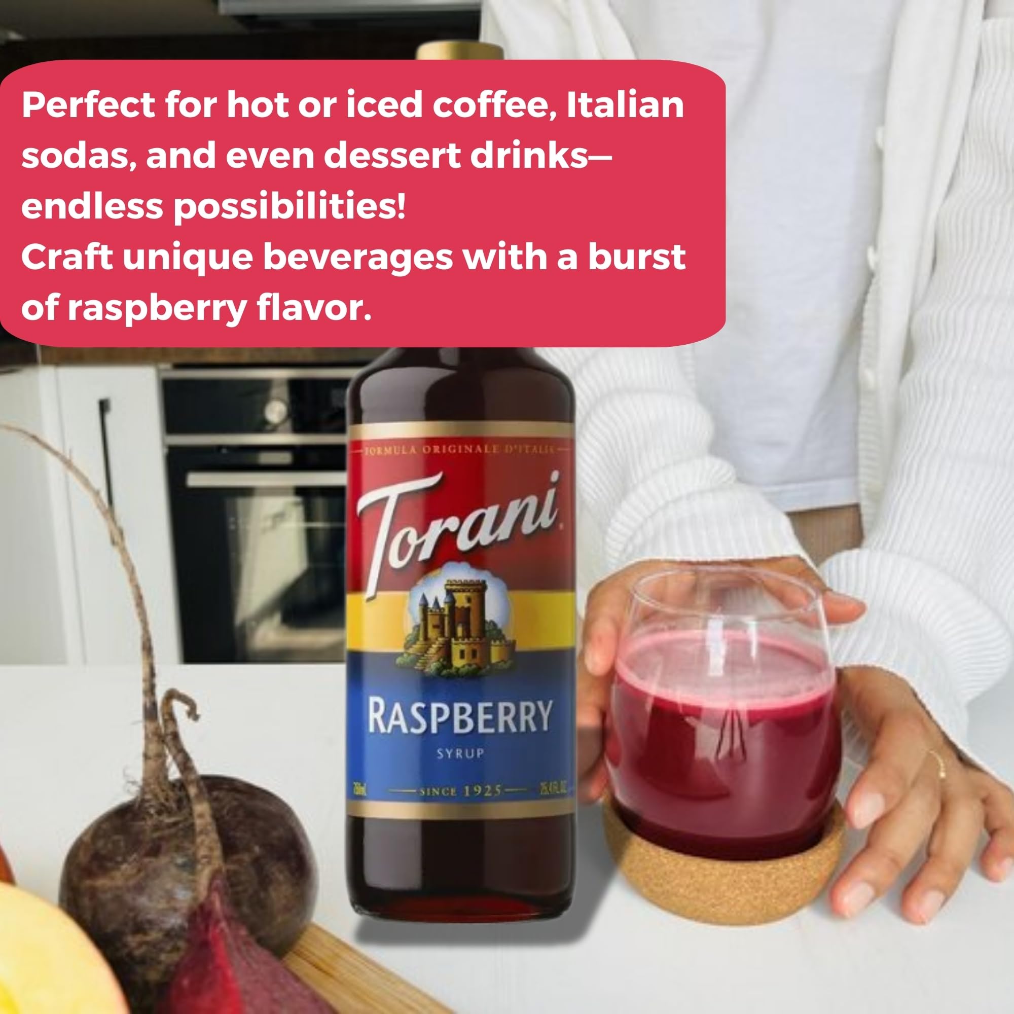 Torani Raspberry Syrup pour into a glass highlights vibrant color and smooth sweetness.