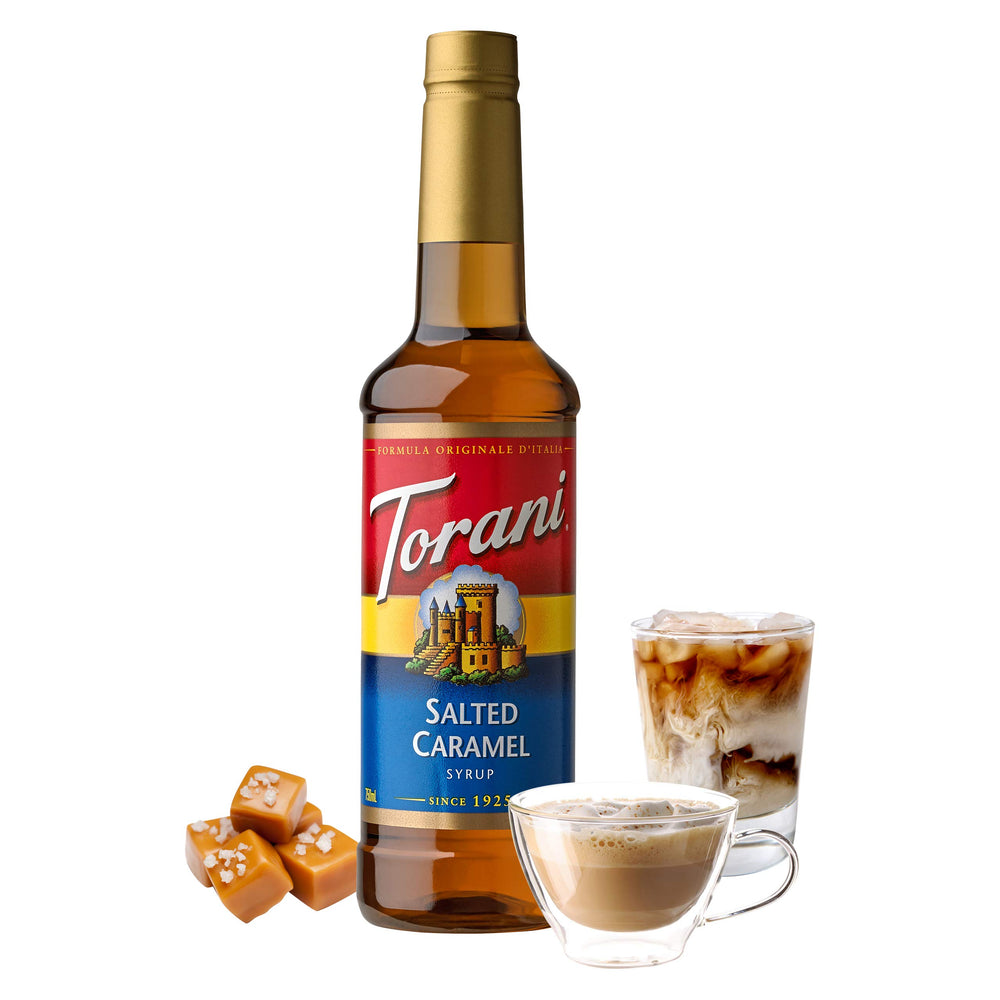 Pouring Torani Salted Caramel Syrup into coffee for a creamy finish.