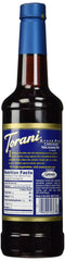 Torani Sugar Free Chocolate Macadamia Nut Syrup being poured for coffee flavor enhancement.