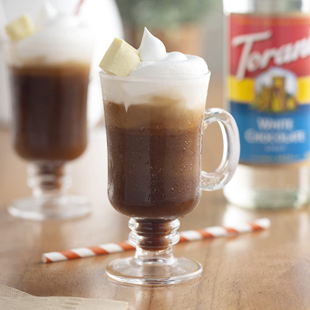 Torani sugar free chocolate syrup bottle on kitchen shelf.