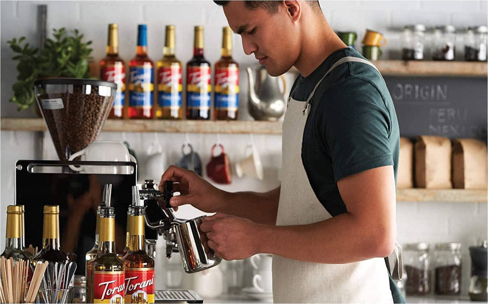 Torani syrup on a cold beverage, vibrant color, ready to flavor iced drinks.