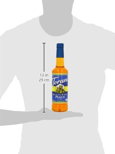 Torani Peach Sugar Free Syrup bottle on kitchen counter.