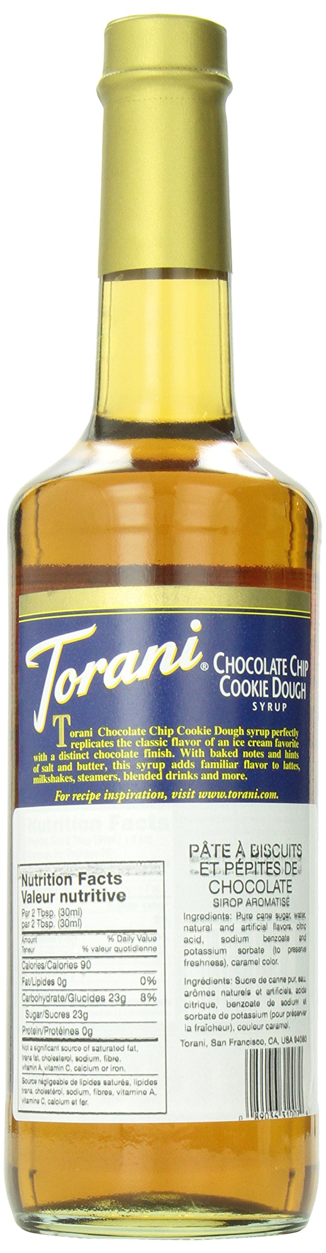Torani syrup bottle beside an espresso cup on a kitchen counter