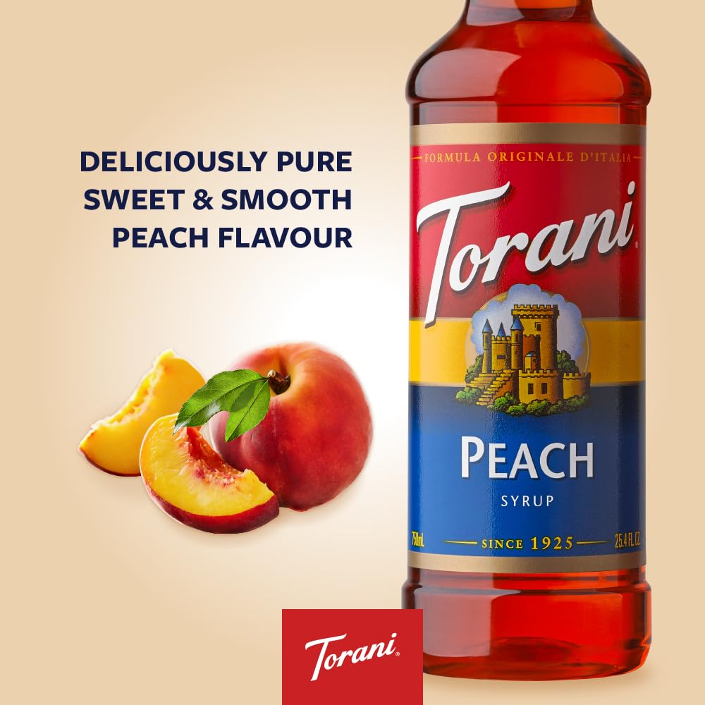 Torani Peach Syrup being poured over ice into a glass for refreshment.