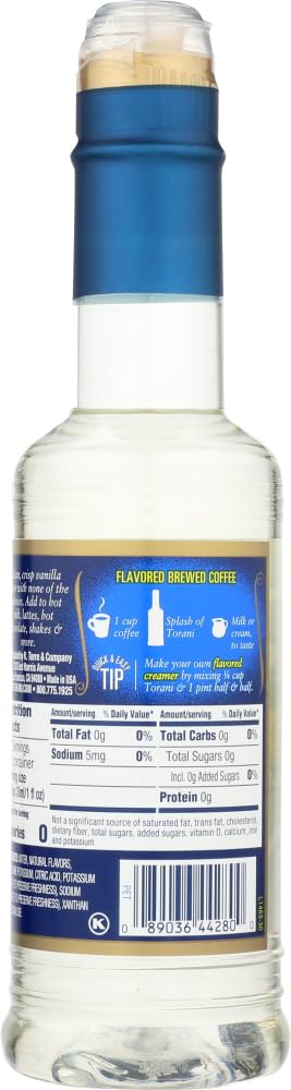 Torani Vanilla Syrup bottle beside a cup, showcasing sugar free flavor.