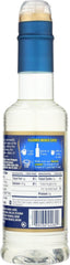 Torani Vanilla Syrup bottle beside a cup, showcasing sugar free flavor.