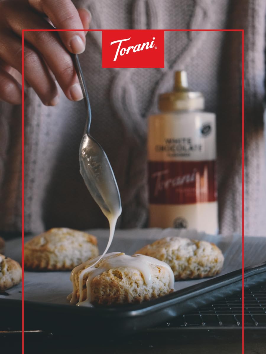 Torani White Chocolate Sauce drizzled over dessert for rich sweetness