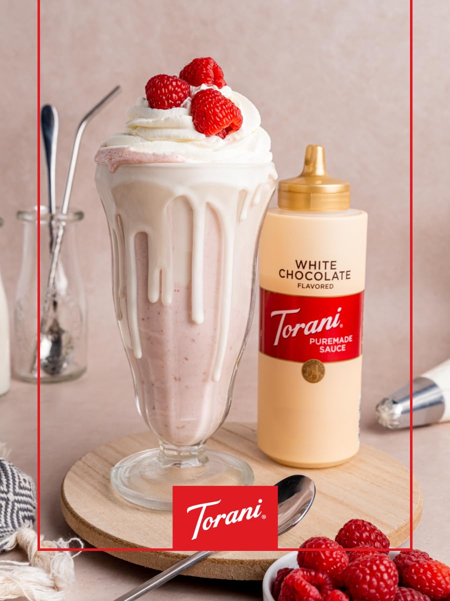 Torani White Chocolate Sauce on a cup ready for drizzling