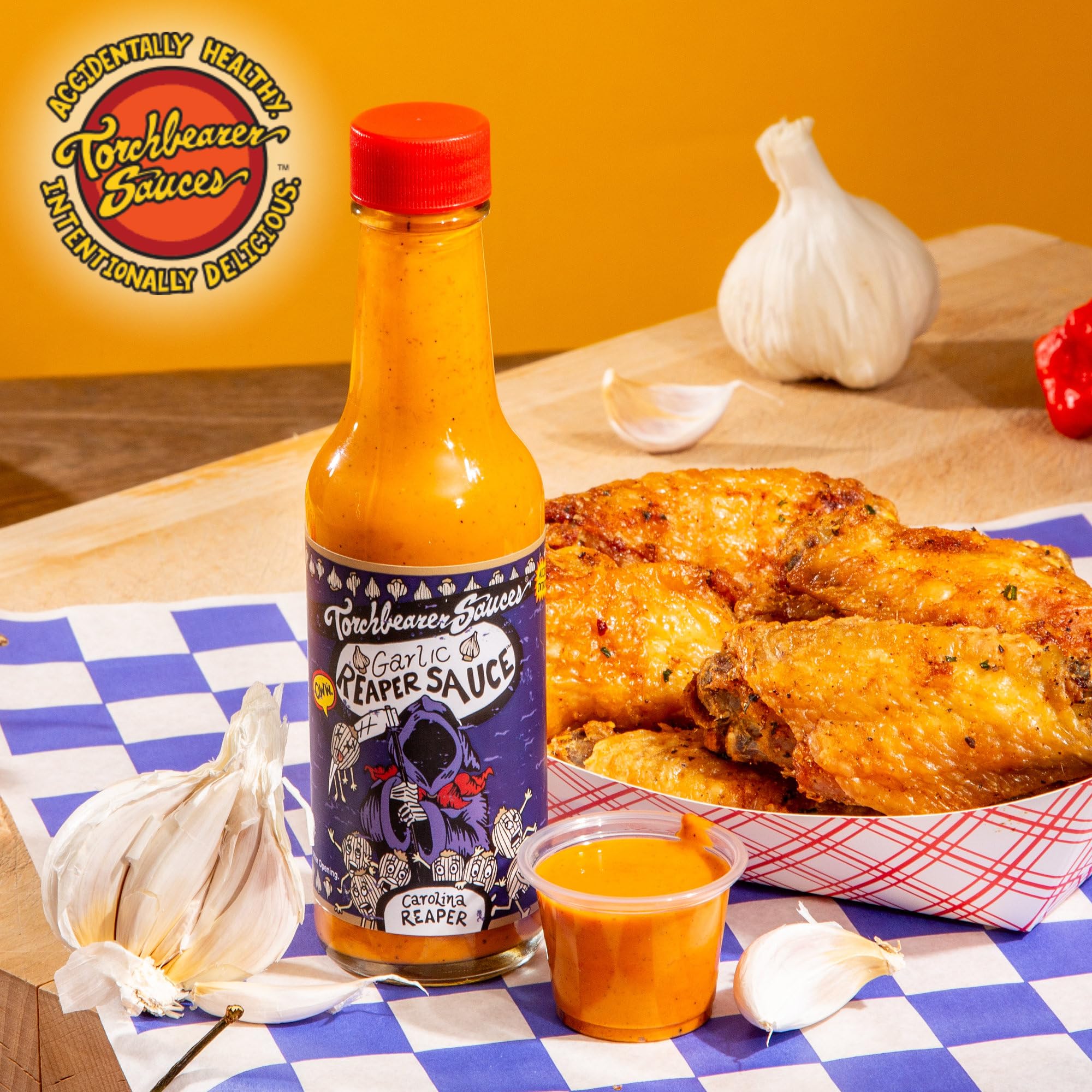 Dramatic drizzle of Torchbearer Garlic Reaper sauce over a dish