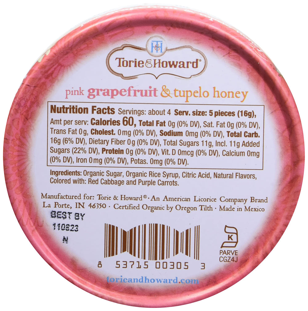 Open Torie & Howard tin reveals glossy pink grapefruit candies.