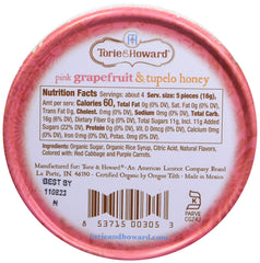 Open Torie & Howard tin reveals glossy pink grapefruit candies.