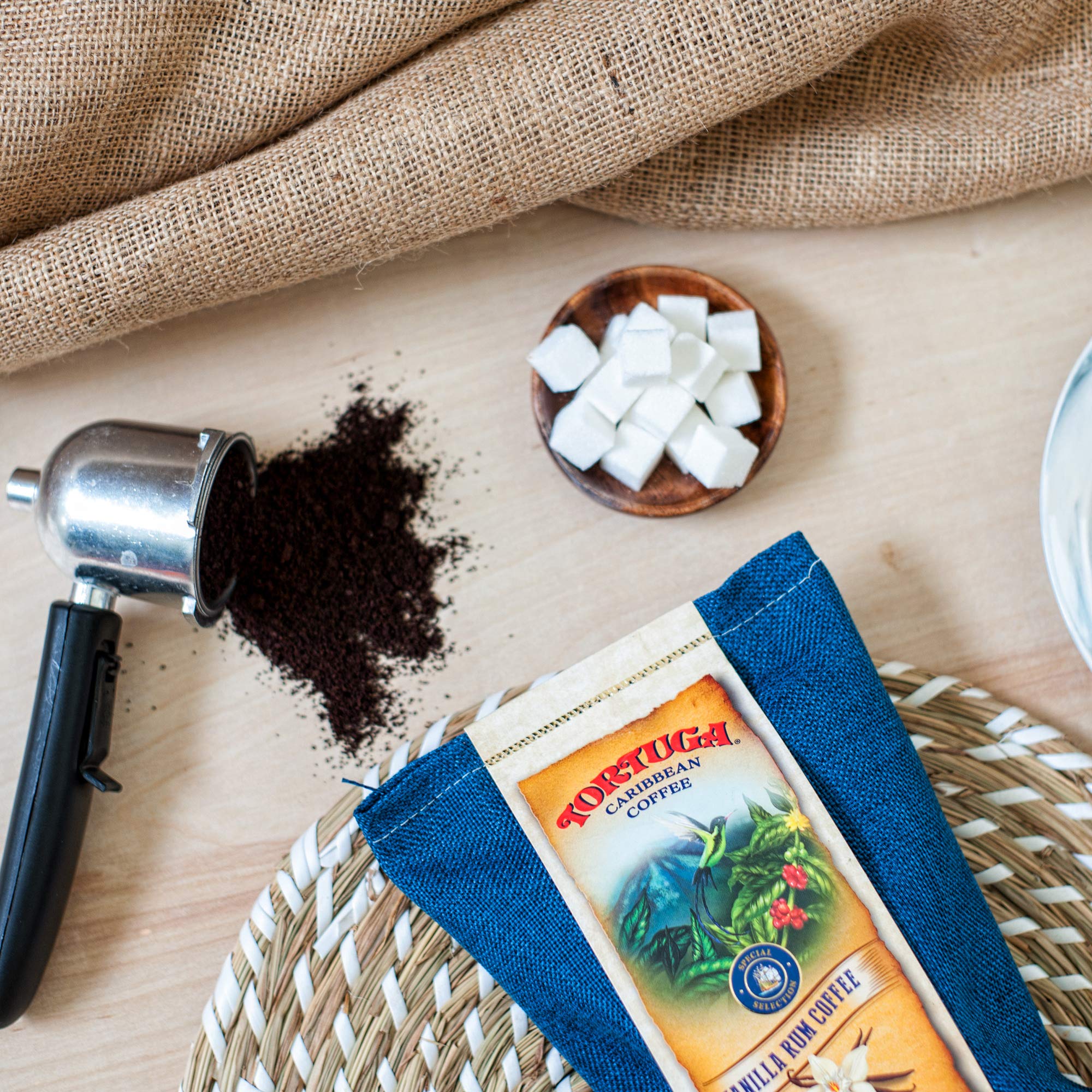 TORTUGA ground coffee beans closeup for a bold Caribbean-inspired cup.