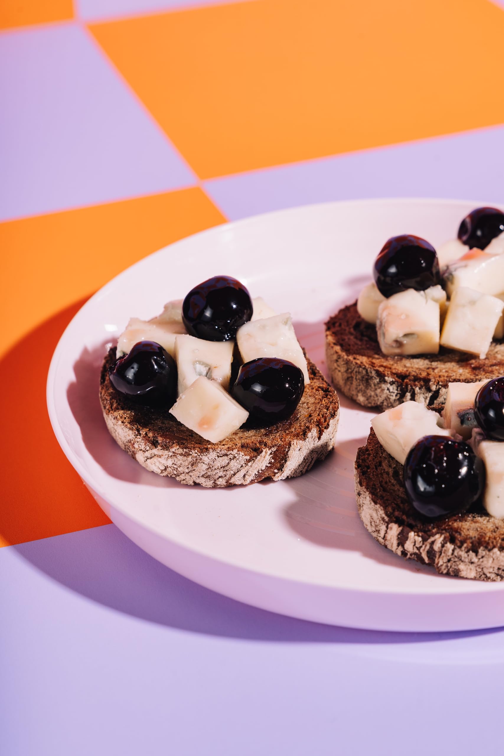 Toschi Amarena cherries on a cheese board for visual impact.