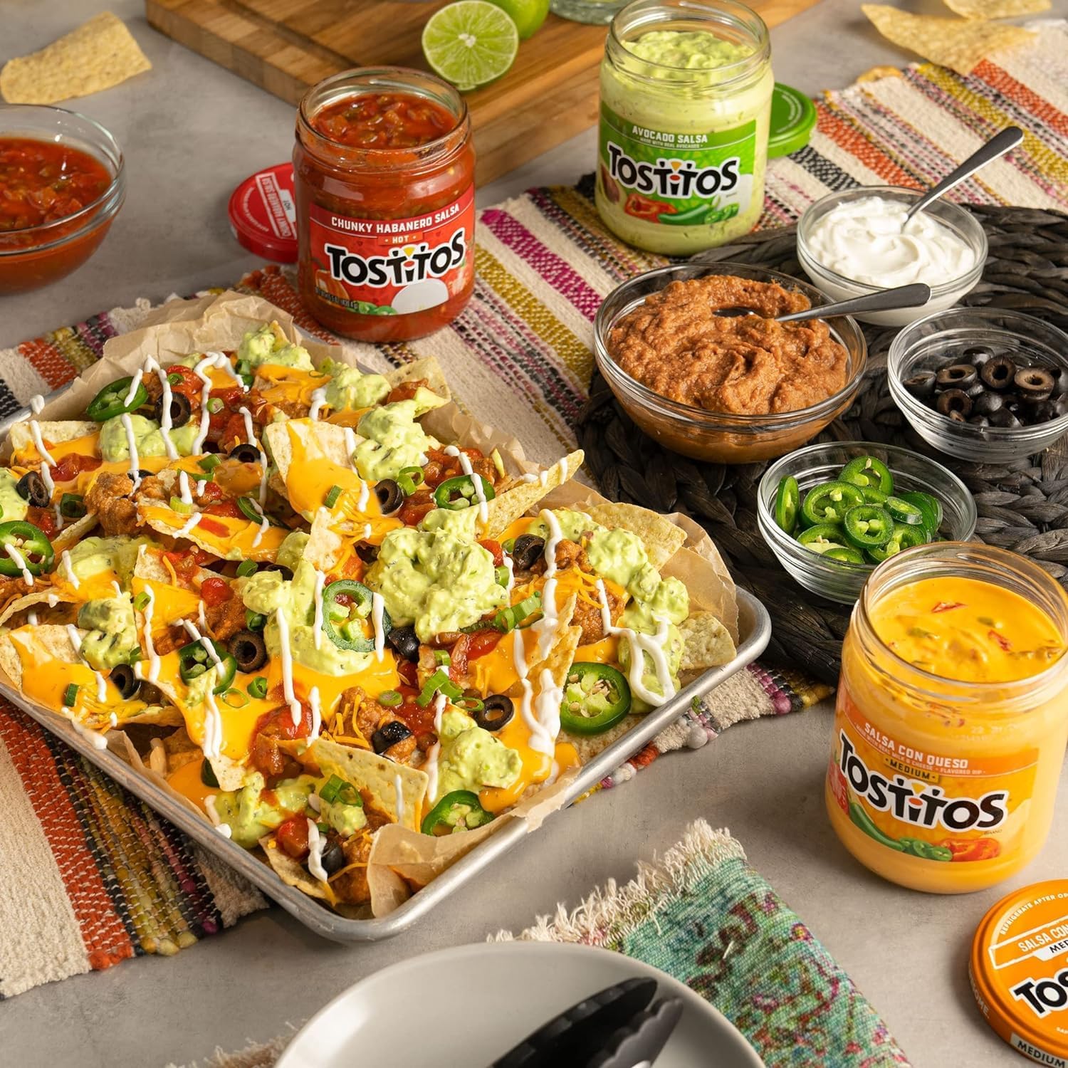 Salsa dip served with chips on a platter for sharing with friends.