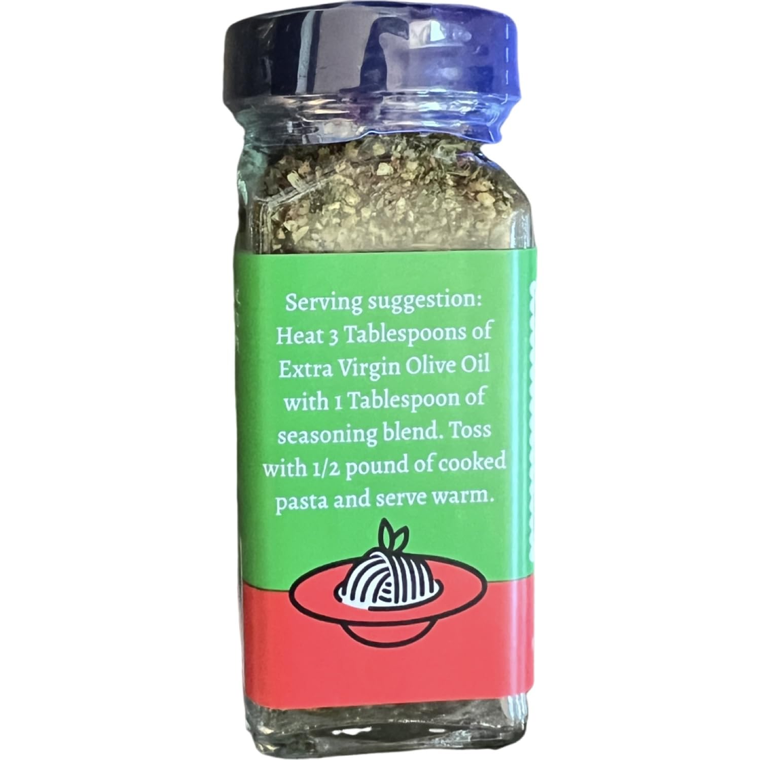 Pouring Trader Joe's Aglio Olio over pasta for garlicky, spicy flavor
