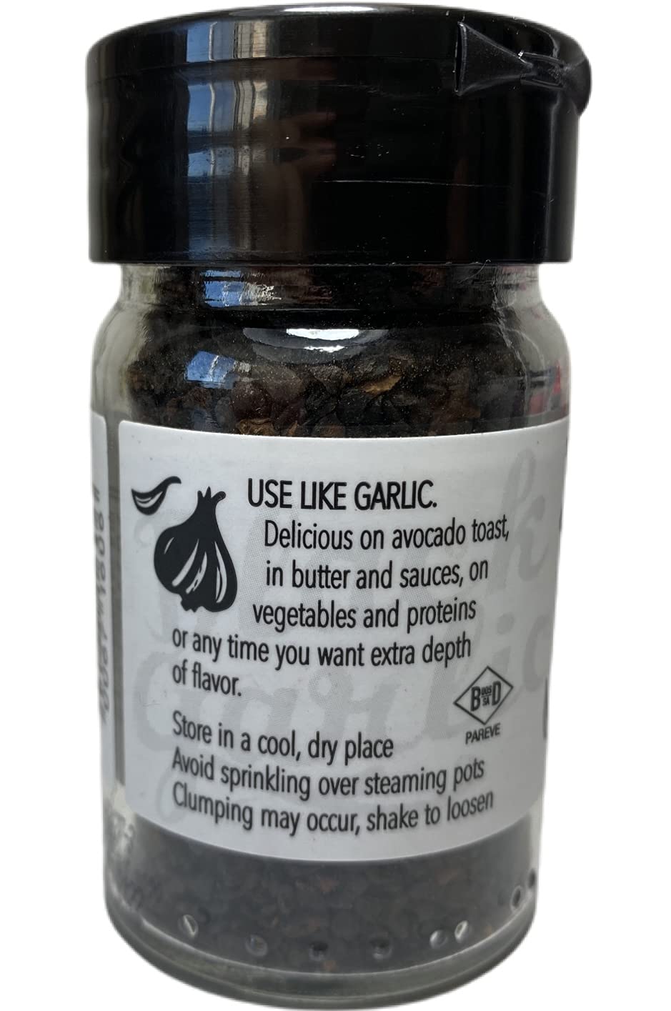 Close-up of ground fermented black garlic texture by Trader Joe's for cooking depth.