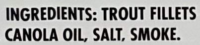 Trader Joe's smoked trout fillets in oil, side view, skinless texture for salads.
