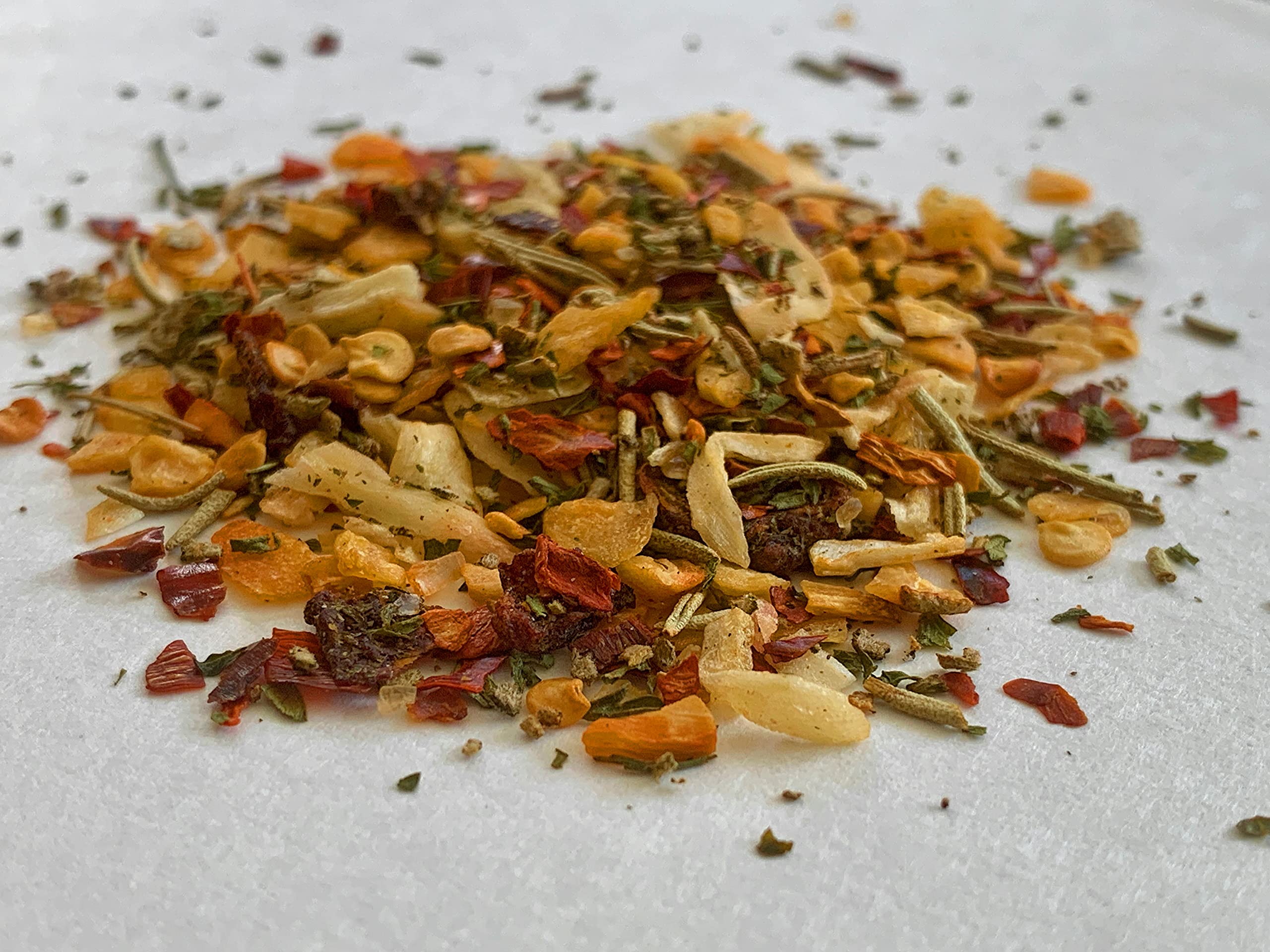 Soffritto mix sizzles with vegetables to create warm Italian flavors.