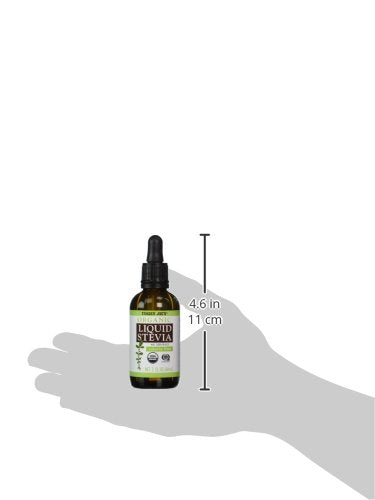 Trader Joe's Organic Liquid Stevia bottle with glass, perfect for flavoring beverages.
