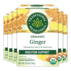 Traditional Medicinals Ginger Tea in a steaming cup promotes digestion and cozy moments.
