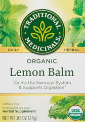 Steeping cup of Traditional Medicinals Lemon Balm tea with a soft lemon hue