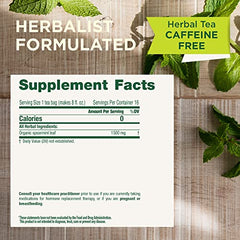 A mug shows Traditional Medicinals Spearmint tea steeping with a fragrant aroma.
