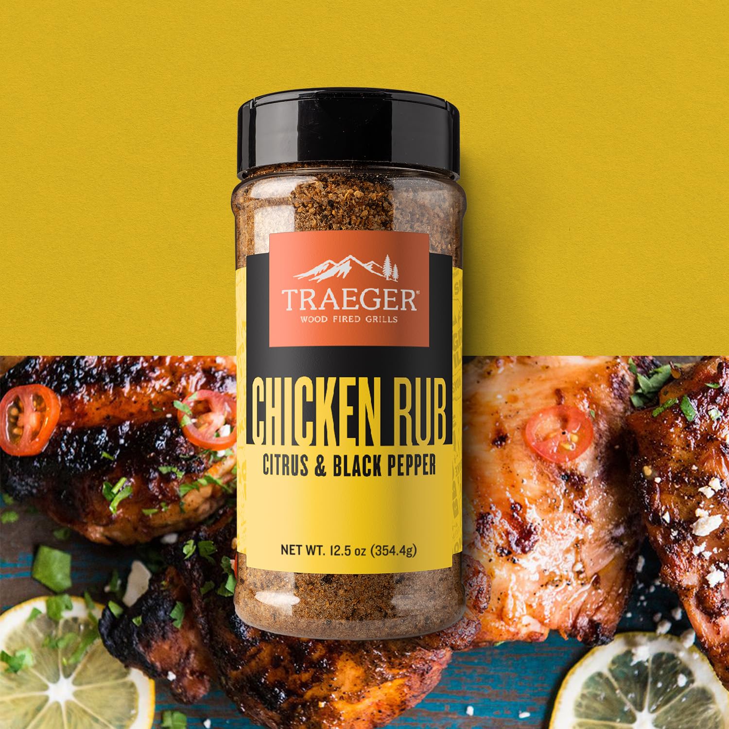 Traeger rub dust pours onto chicken, revealing balanced citrus and heat