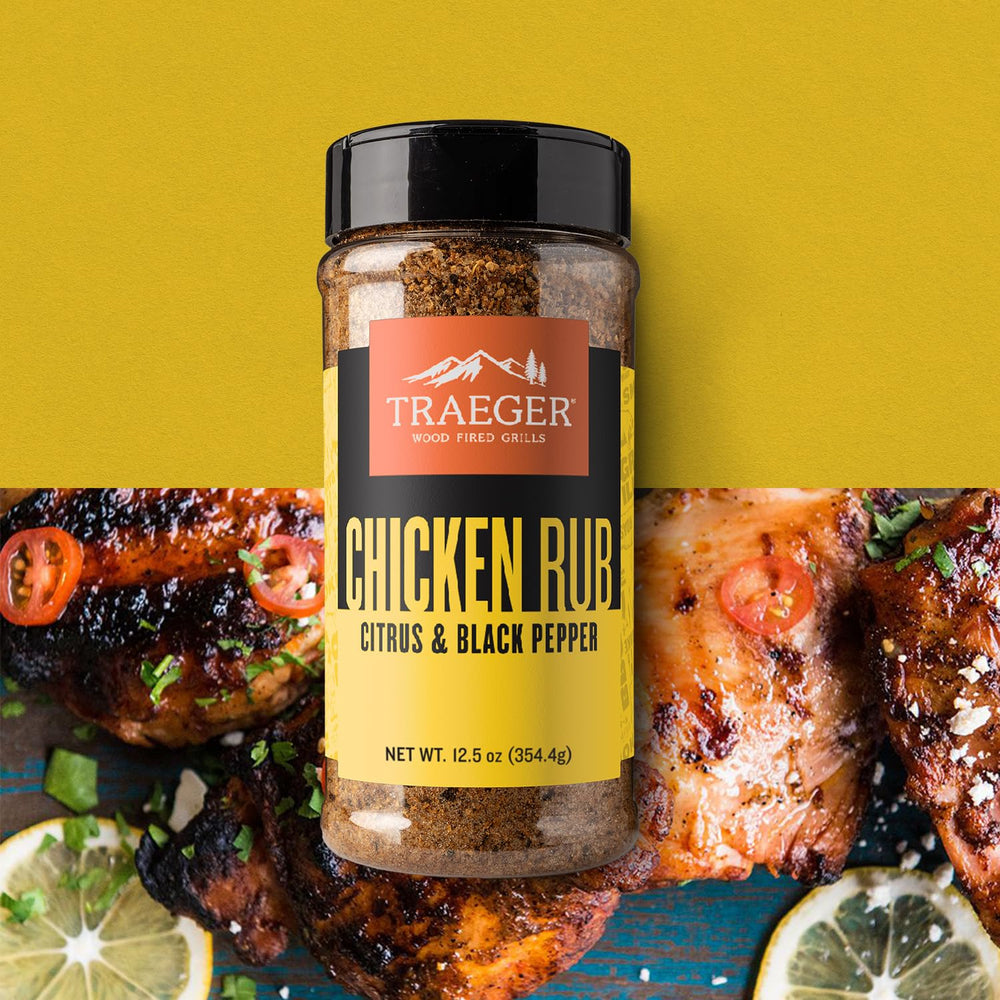 Traeger rub dust pours onto chicken, revealing balanced citrus and heat
