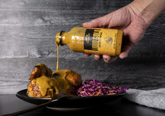 Traeger Liquid Gold BBQ Sauce on pulled pork for juicy finish.