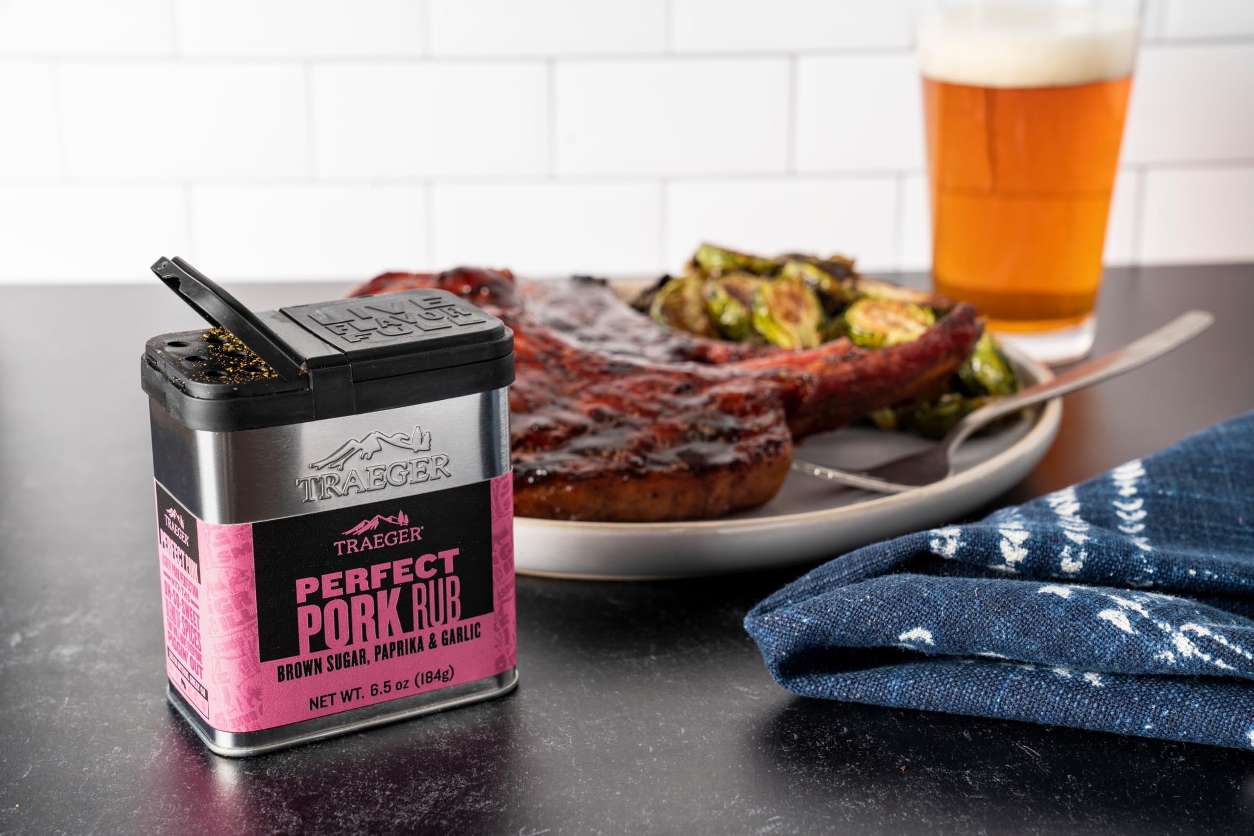 Traeger Perfect Pork Rub tin on a kitchen counter for convenient storage.