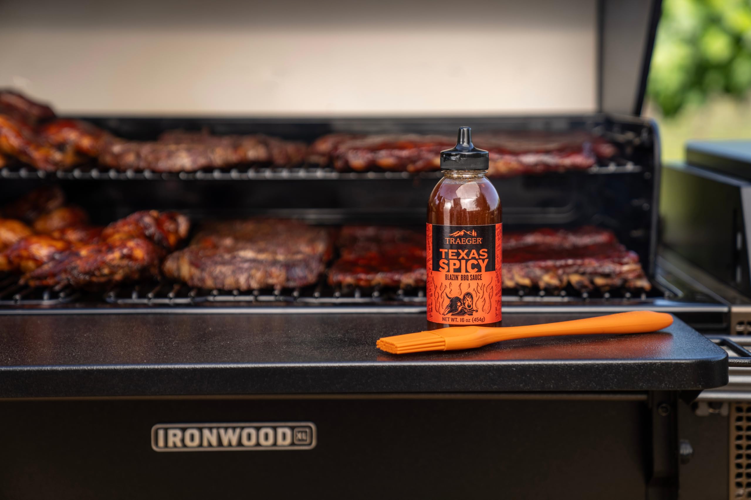 Traeger Texas Spicy BBQ Sauce on wings delivers bold peppery heat and glaze